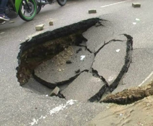 A road cave-in during the monsoons